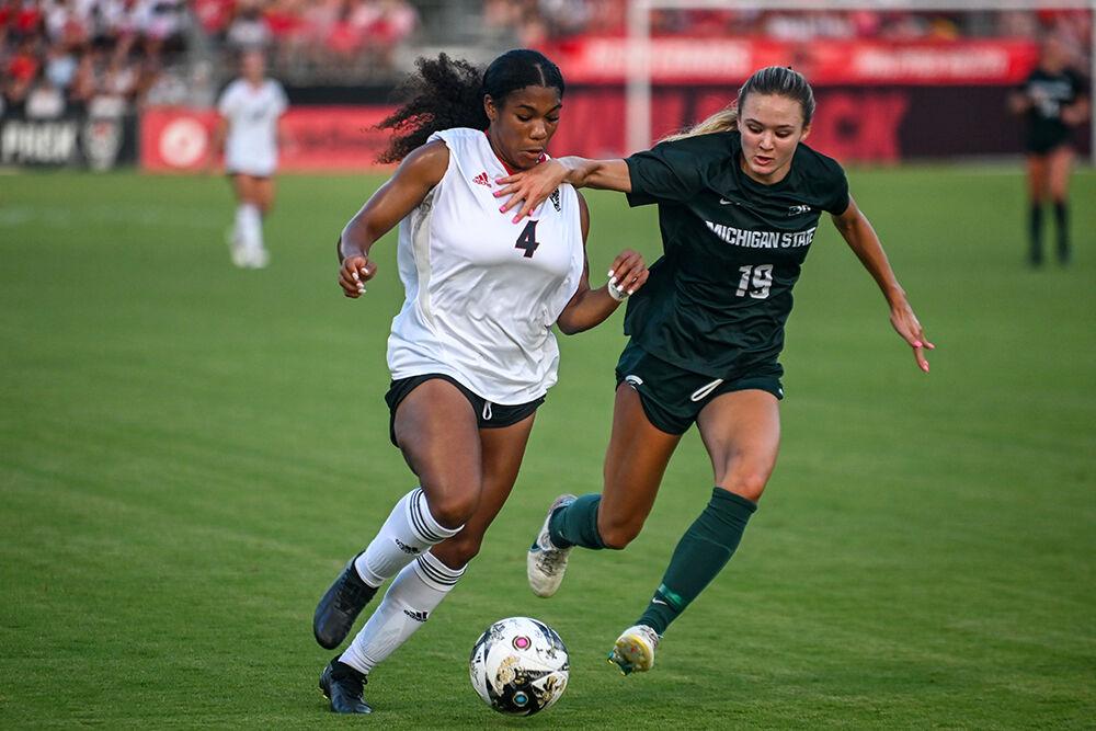 Senior forward Leyah Hall-Robinson dribbles the ball down the field during the match against Michigan State at Dail Soccer Field on Thursday, Sept. 7, 2023. Hall-Robinson made one shot for the Wolfpack. NC State lost to Michigan State 2-1.