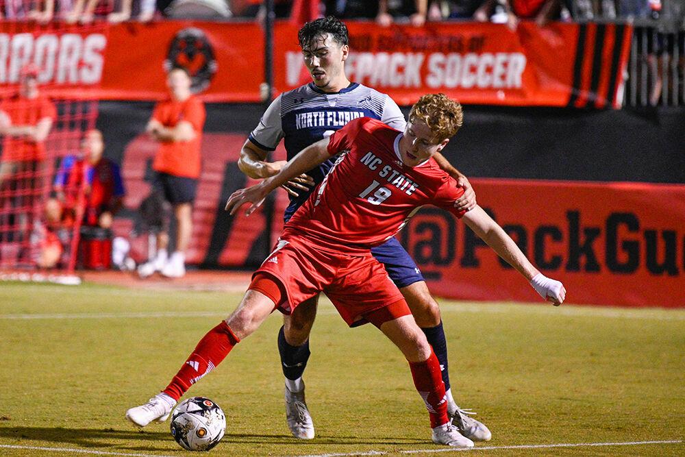 Graduate forward Scotty Taylor fights for possession of the ball during the match against the University of North Florida at Dail Soccer Field on Wednesday, Sept. 20, 2023. NC State beat the University of North Florida 1-0.