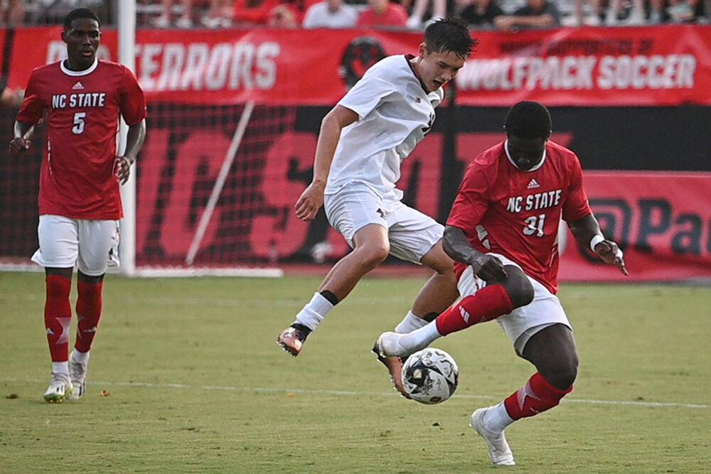 Freshman forward Hakim Karamoko attempts to steal the ball in the match against Boston College at Dail Soccer Field on Friday, Sept. 8, 2023. Karamoko made three shots for the Pack. NC State won the match 2-0.