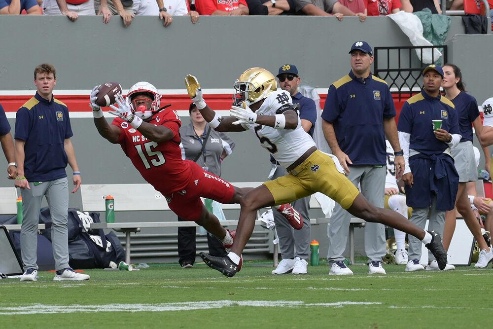 Senior wide reciever Keyon Lesane makes a diving grab for 38 yards during the Wolfpack's home opener against the Notre Dame Fighting Irish in Carter-Finely Stadium on Saturday, Sept. 9, 2023. Lesane ran for 12 yards and caught for 53. The Irish defeated the Wolfpack 45-24.