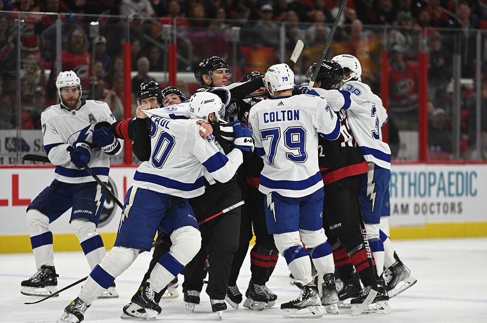 The teams get into a shoving match and are seperated by the referees during the Hurricanes' home game against the Tampa Bay Lightning in PNC Arena on Tuesday, March 28, 2023. The Lightning beat the Canes 4-0.