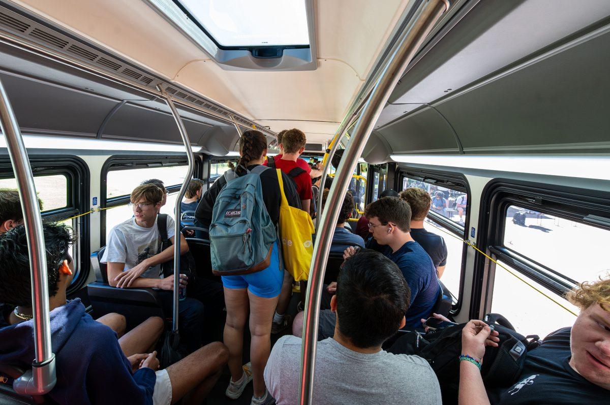 Students crowd a Route 40 Wolfline Bus on Friday, Sept. 15, 2023. The Route 40 bus connects Centennial and Main campus.