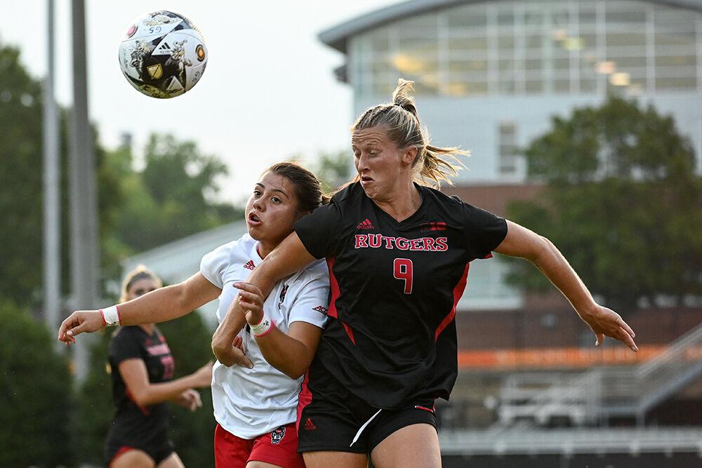 Junior defender Fernanda Soto and Rutgers graduate back Allison Lynch jump to head the ball during the match at Dail Soccer Field on Thursday, Aug. 24, 2023. NC State and Rutgers tied 1-1.