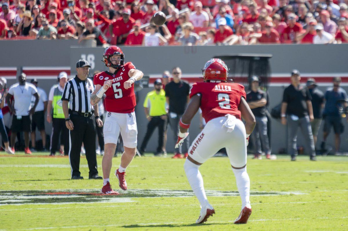 Graduate quarterback Brennan Armstrong passes to sophomore running back Michael Allen during the football game against Virginia Military Institute in Carter-Finely Stadium on Saturday, Sept. 16, 2023. Armstrong threw for 264 yards. The Wolfpack beat the Keydets 45-7.