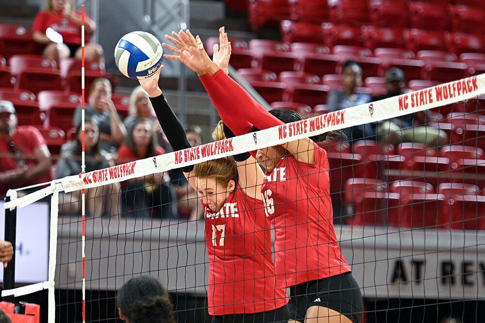 Junior opposite hitter Amanda Rice and junior middle blocker Jada Allen block the ball during the game against Howard University&#160;in Reynolds Coliseum on Thursday, Aug. 31, 2023. NC State beat Howard University 3-1.