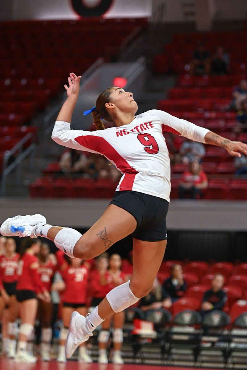 Senior libero Skye Stokes serves the ball during the game against Howard University in Reynolds Coliseum on Thursday, Aug. 31, 2023. Stokes made 16 digs for the Wolfpack. NC State beat Howard University 3-1.