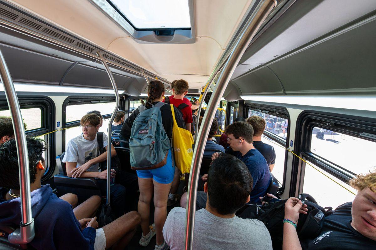 Students crowd a Route 40 Wolfline Bus on Friday, Sept. 15, 2023. The Route 40 bus connects Centennial and Main campus.