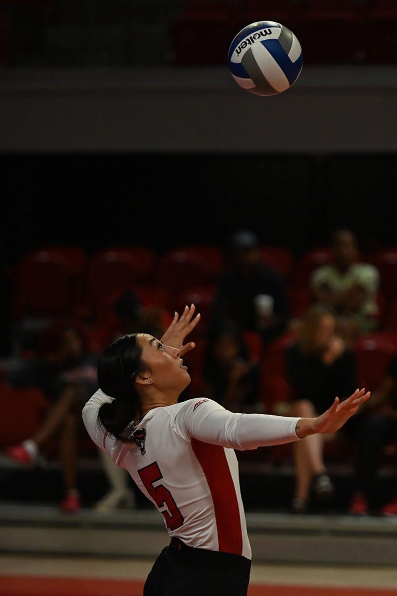 Graduate setter Kristen McDaniel serves the ball during the match against George Washington University at Reynolds Coliseum on Wednesday, Sept. 13, 2023. NC State beat George Washington with a score of 3-0.