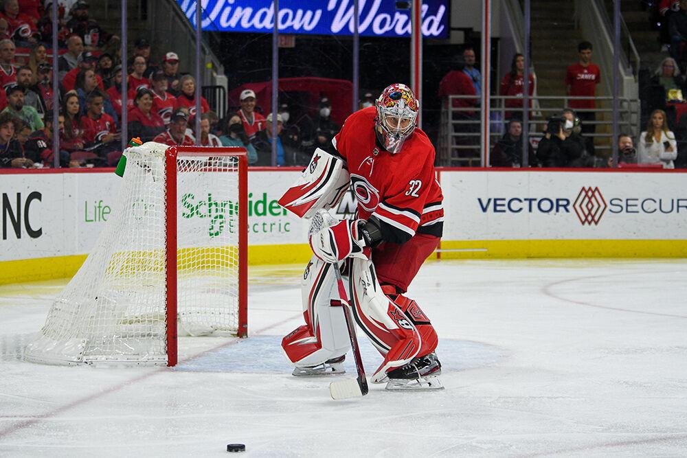 Carolina Hurricanes goalie Aanti Raanta passes the puck during the game against the Detroit Red Wings on Thursday, April 14, 2022 in PNC Arena. Raanta had a total of 19 saves during the game. The Hurricanes lost to the Red Wings 3-0.