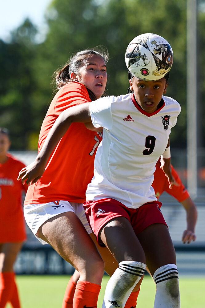 Freshman forward Hannah Jibril blocks off the Virginia defender to secure the loose ball at Dail Soccer Field on Sunday, Oct. 8, 2023. Jibril had one assist against Virginia. The Wolfpack beat the Cavaliers 2-1.