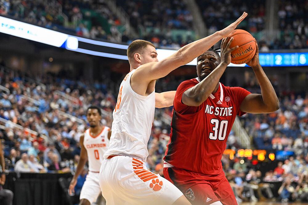 Graduate forward DJ Burns eyes the net during the quarterfinal round of the ACC Tournament against Clemson in Greensboro Coliseum on Thursday, March 9, 2023. Burns led the team in points scored, scoring 12 for NC State. The Wolfpack lost the game to the Tigers 80-54.