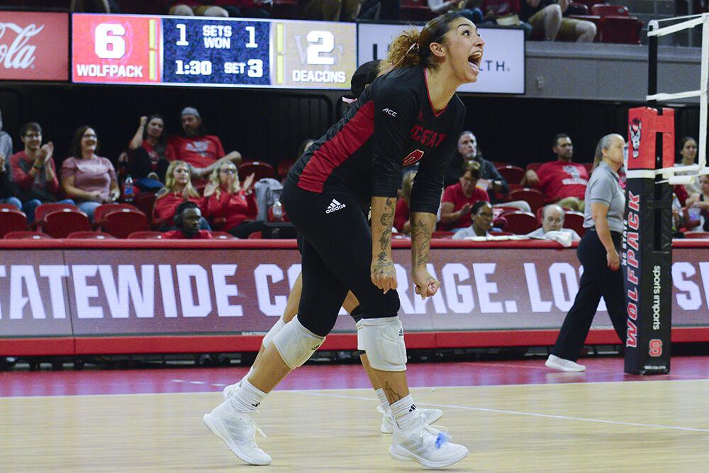 Senior libero Skye Stokes celebrates a point scored during the match against Wake Forest in Reynolds Coliseum on Friday, Oct. 13, 2023. Stokes had 18 digs. The Wolfpack defeated the Demon Deacons 3-1.