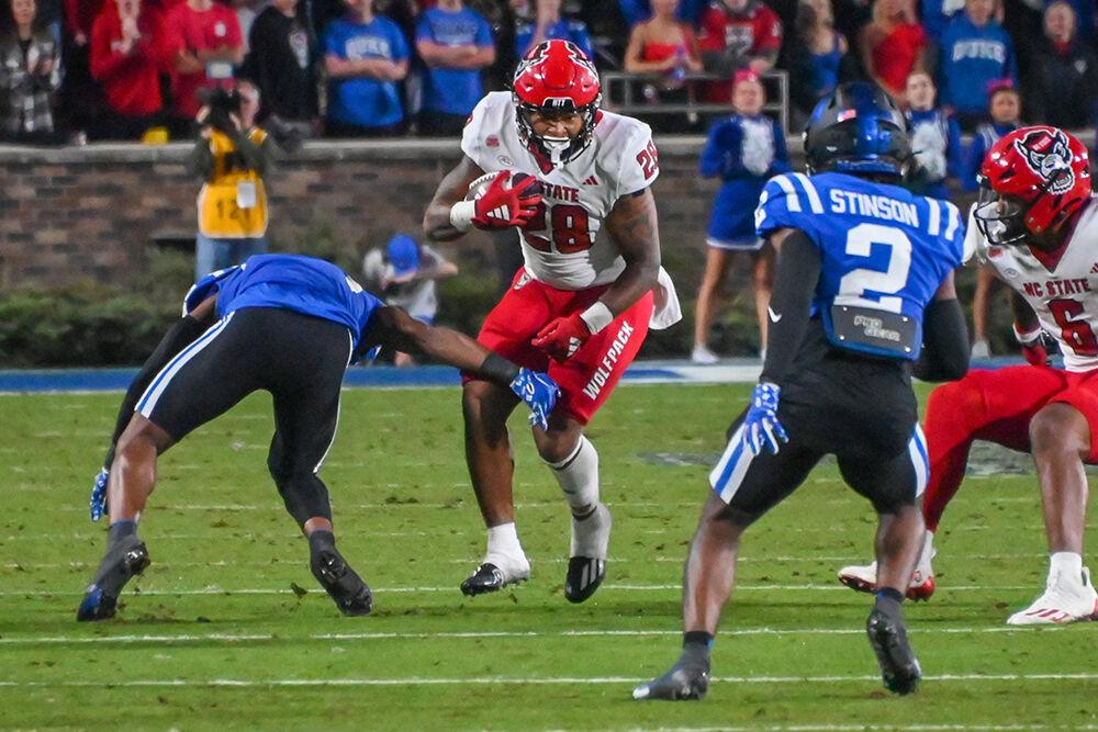 Redshirt junior running back Demarcus Jones II runs against the Blue Devils defense during the Wolfpack's game against the Duke Blue Devils at Wallace Wade Stadium on Saturday, Oct. 14, 2023. The Blue Devils beat the Wolfpack 24-3.
