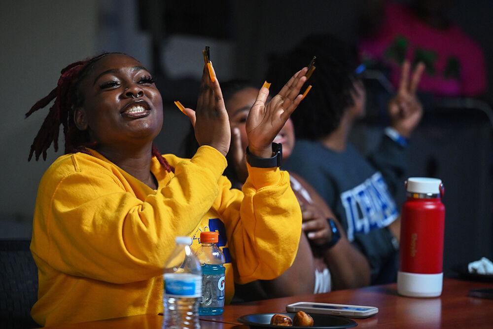 Lauren Clark, a fourth-year studying english, claps during Family Feud at Witherspoon Student Center on Friday, Oct. 6, 2023. This was one of the many events held during National Pan-Hellenic Council Week at NC State.