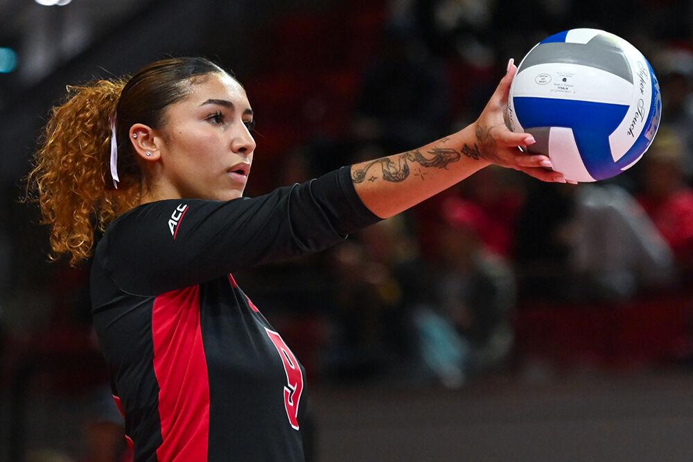 Senior libero Skye Stokes prepares to serve the ball during the match against Pitt at Reynolds Coliseum on Friday, Oct. 20, 2023. NC State lost to Pitt 3-0.