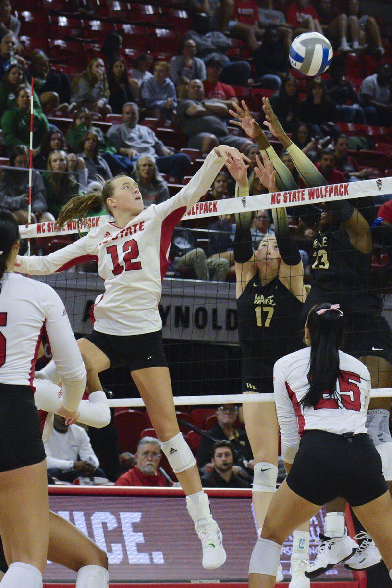 Sophomore outside hitter Courtney Bryant tips the ball during the match against Wake Forest in Reynolds Coliseum on Friday, Oct. 13, 2023. Bryant had 11 kills. The Wolfpack defeated the Demon Deacons 3-1.