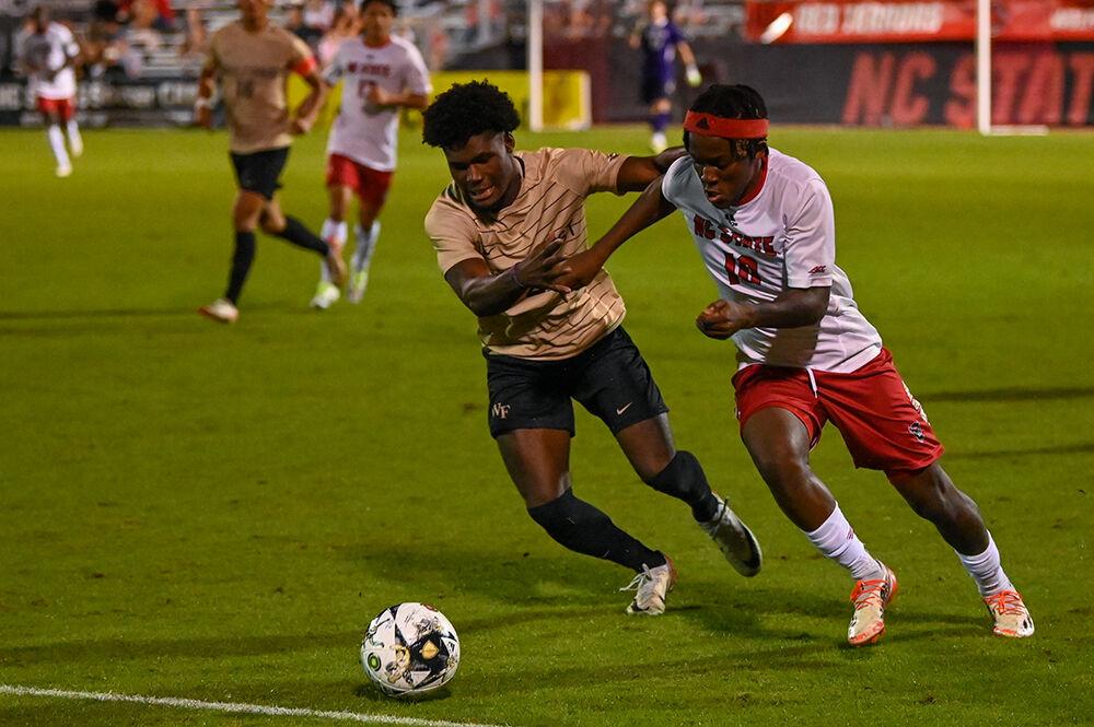 Senior forward Junior Nare struggles to get access of the ball during the match against Wake Forest at Dail Soccer Field on Friday, Oct. 6, 2023. NC State lost to Wake Forest 3-0.