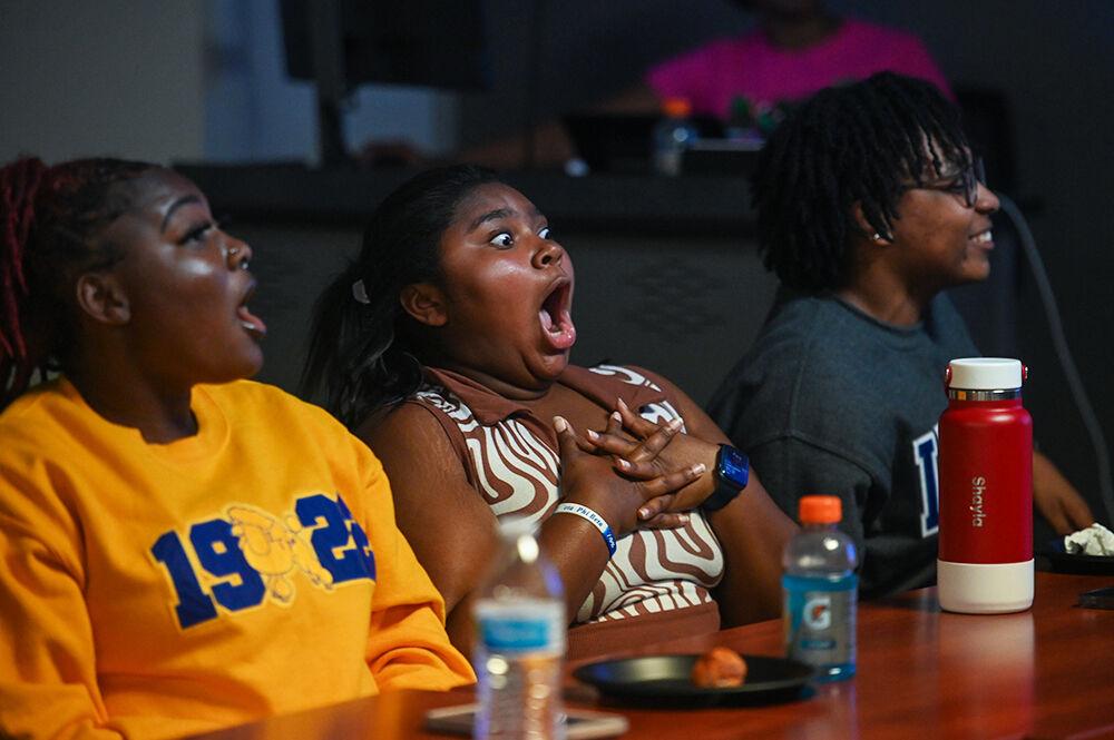 (From left) Lauren Clark, a fourth-year studying english, Shayla Waugh, a second-year studying animal science and Nayah McKenzie, a third-year studying computer engineering, are visibly surprised during Family Feud at Witherspoon Student Center on Friday, Oct. 6, 2023. This was one of the many events held during National Pan-Hellenic Council Week at NC State.