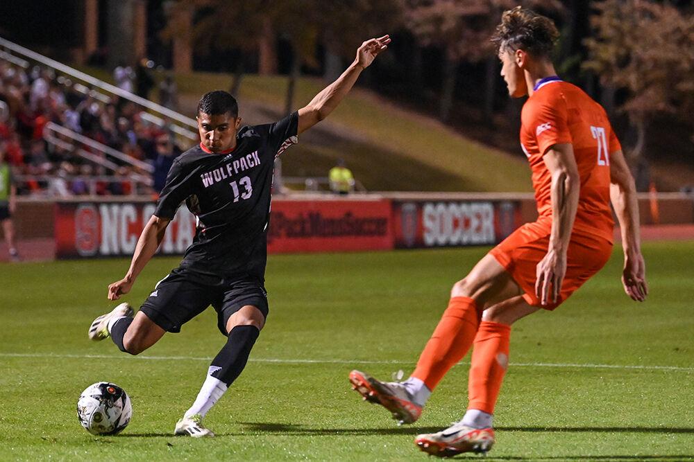 Sophomore midfielder Calem Tommy kick the ball during the match against Clemson at Dail Soccer Field on Friday, Oct. 27, 2023. NC State and Clemson tied 1-1.