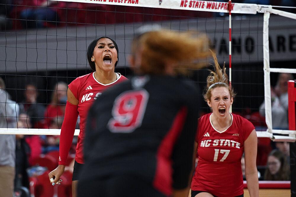 Junior middle blocker Jada Allen and junior opposite hitter Amanda Rice shout after scoring a point during the match against Pitt at Reynolds Coliseum on Friday, Oct. 20, 2023. NC State lost to Pitt 3-0.