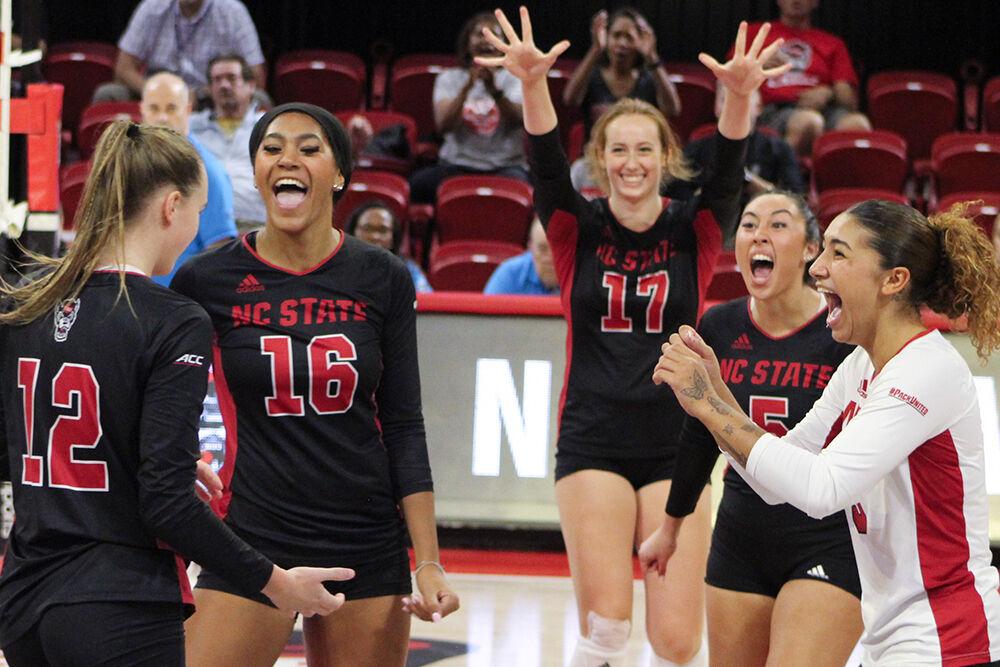 The NC State volleyball team celebrates a kill during the match versus Notre Dame at Reynolds Coliseum on Friday, Sept. 29, 2023. NC State defeated Notre Dame 3-0.&#160;