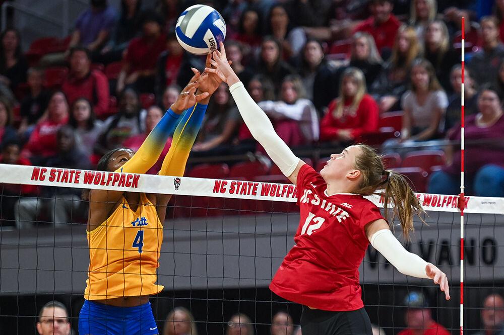 Sophomore outside hitter Courtney Bryant attempts to tip the ball over the block during the match against Pitt at Reynolds Coliseum on Friday, Oct. 20, 2023. NC State lost to Pitt 3-0.