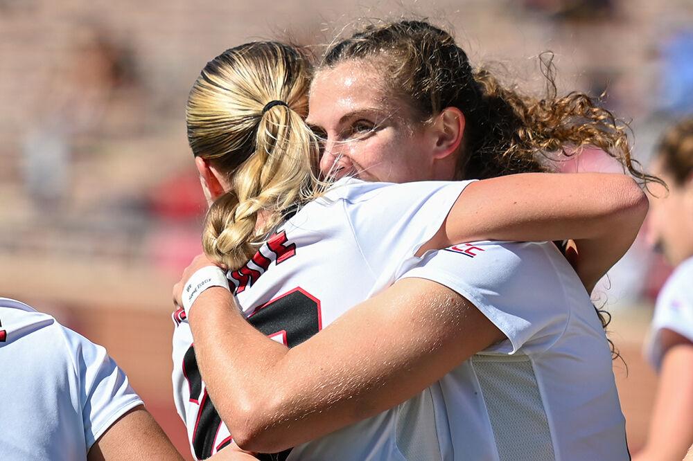 Junior midfielder Annika Wohner hugs senior forward Alexis Strickland after Wohner scored a goal against the Virginia Cavaliers at Dail Soccer Field on Sunday, Oct. 8, 2023. The Wolfpack beat the Cavaliers 2-1.