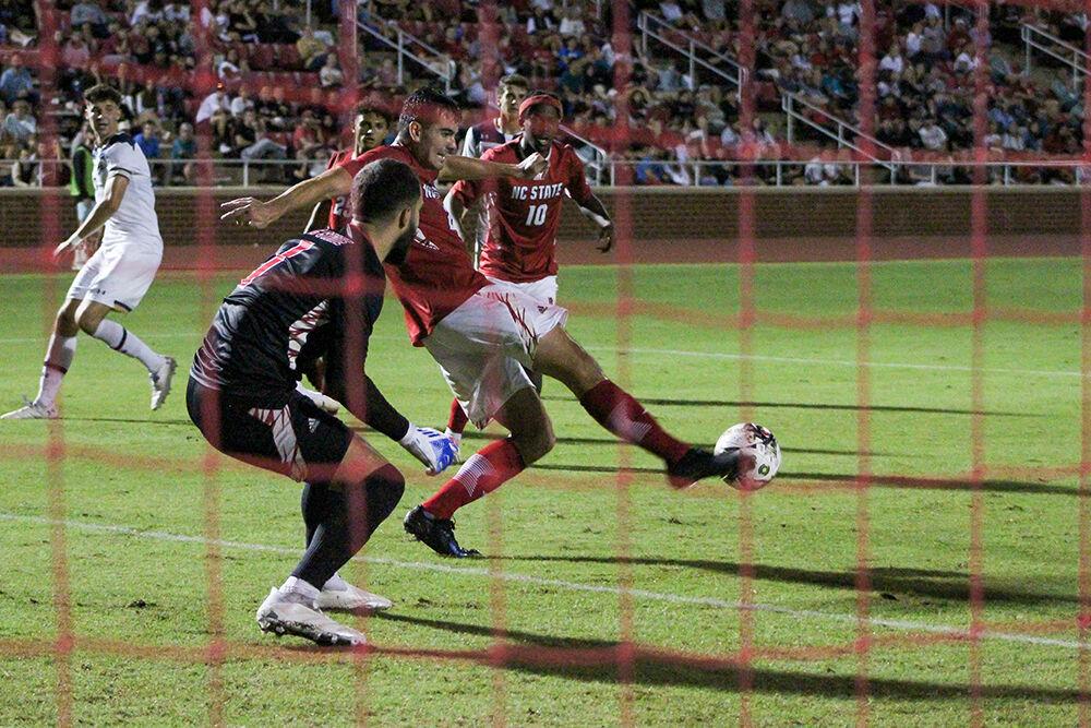 Junior defender Dylan Mitchiner clears the ball during the home soccer game at Dail Soccer Field on Oct. 1, 2023. NC State was defeated by Notre Dame 3-1.