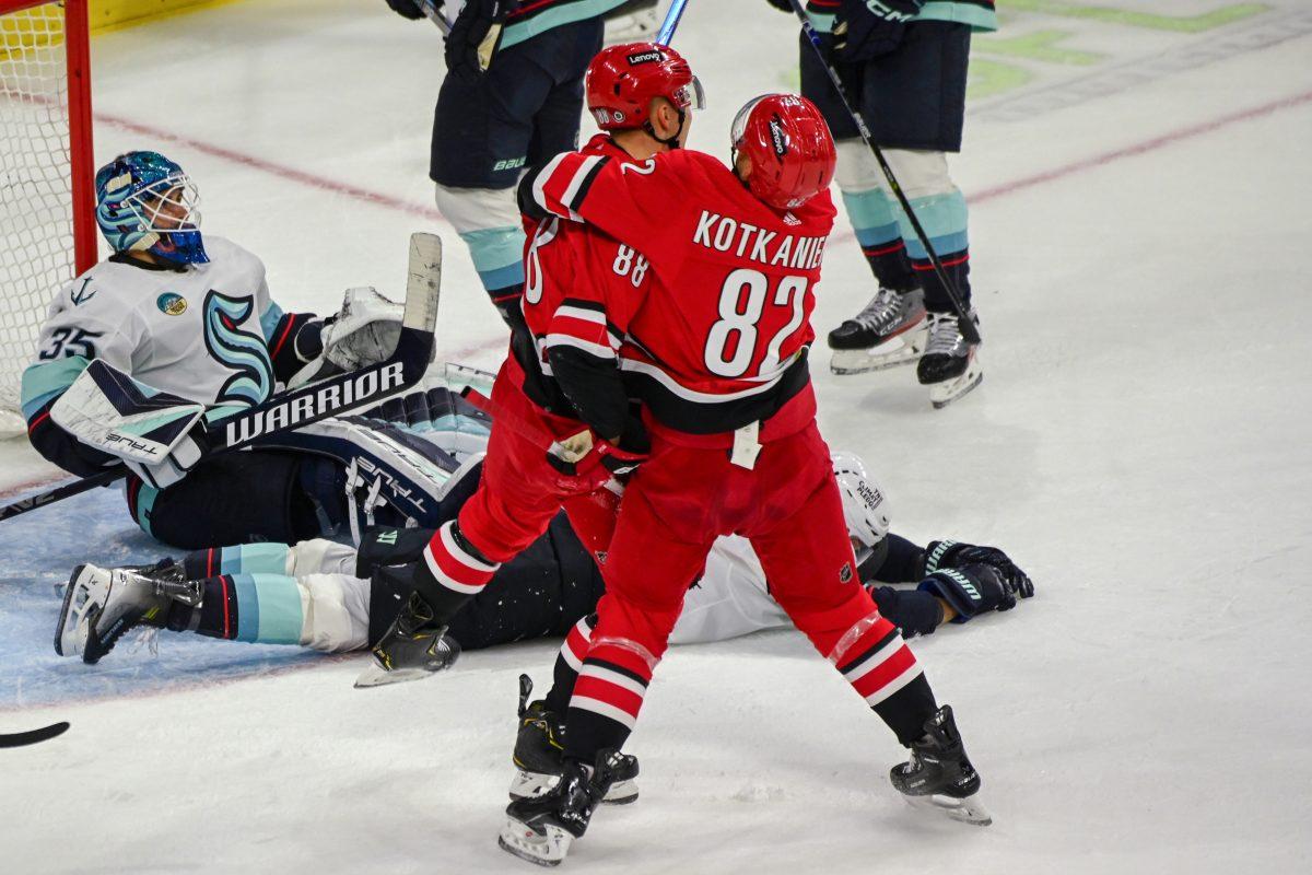 Carolina Hurricanes center Jesperi Kotkaniemi hugs center Martin Necas after a goal during the game against the Seattle Kraken in PNC Arena on Thursday, Oct. 26, 2023. Kotkaniemi had one goal and one assist during the game. The Hurricanes beat the Kraken 3-2 in overtime.