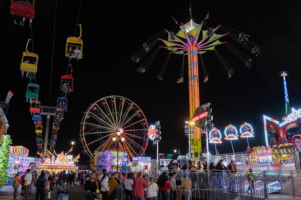 The rides light the scene at the North Carolina State Fair on Friday, Oct. 13, 2023. Rides are a fan favorite of the many things to do at the NC State Fair. The fair was held from Oct. 12-22, 2023.