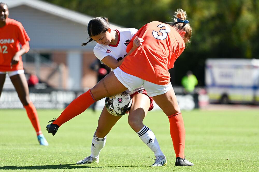 Sophomore forward Cienna Kim battles for the ball during the match versus the Virginia Cavaliers at Dail Soccer Field on Sunday, Oct. 8, 2023. The Wolfpack beat the Cavaliers 2-1.