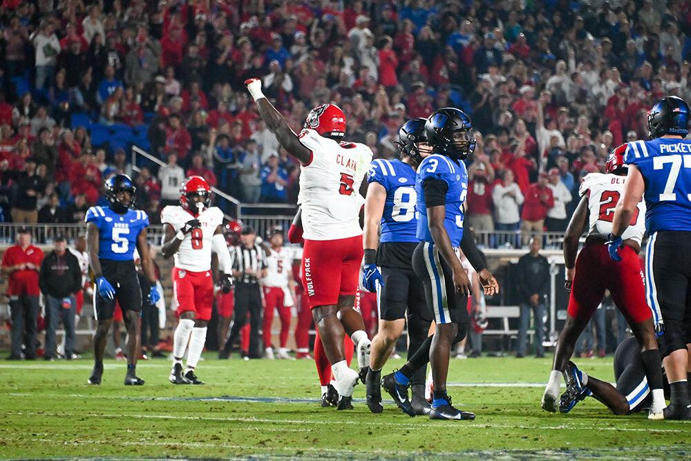 Redshirt junior defemsive tackle C.J. Clark celebrates after tackling a Blue Devils player during the Wolfpack's game against the Duke Blue Devils at Wallace Wade Stadium on Saturday, Oct. 14, 2023. Clark had 3 tackles in the game. The Blue Devils beat the Wolfpack 24-3.