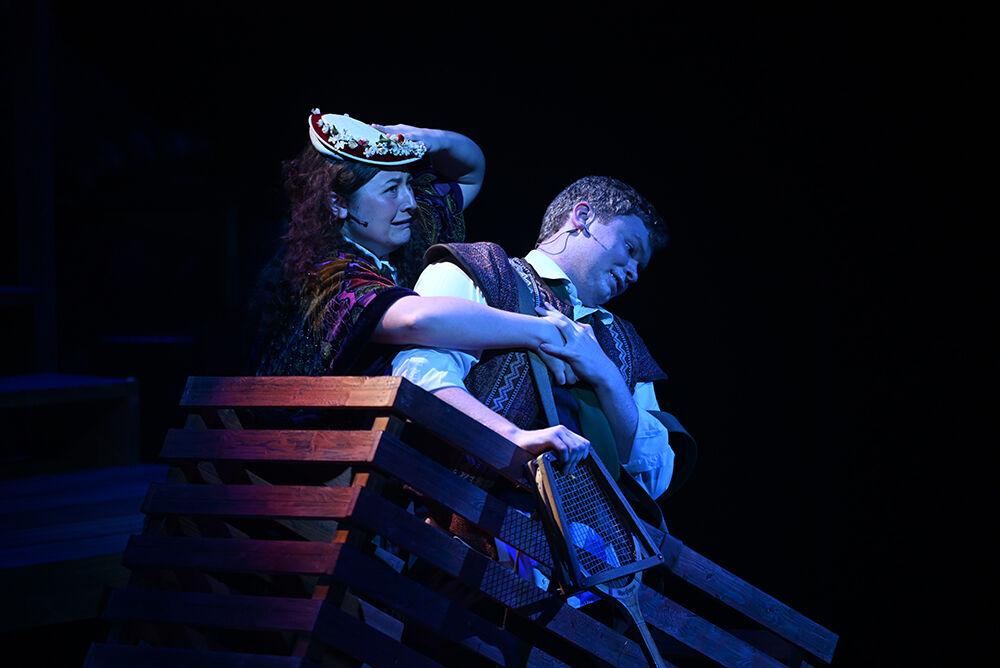 Spotlight on Brinley Cate Carter, a first-year studying communication media as Mrs. Bumbrake and Andrew Campbell Sunderlage, a second-year studying computer engineering as Alf, during the dress rehearsal for NC State University Theatre's performance of "Peter and the Starcatcher" at Titmus Theatre on Wednesday, Oct. 18., 2023. "Peter and the Starcatcher" is a whimsical and imaginative prequel to Peter Pan, exploring the adventures that lead Peter to Neverland.