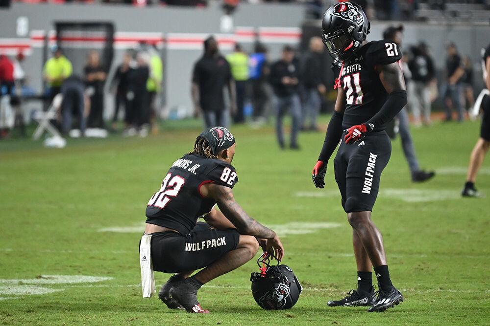 Sophomore wide reciever Terrell Timmons Jr. (left) speaks to redshirt sophomore wide reciever Jalen Coit (right) after the Wolfpack's home football game against the Louisville Cardinals at Carter-Finley Stadium on Friday, Sept. 29, 2023. Timmons had 71 yards from three receptions. The Cardinals beat the Wolfpack 13-10.