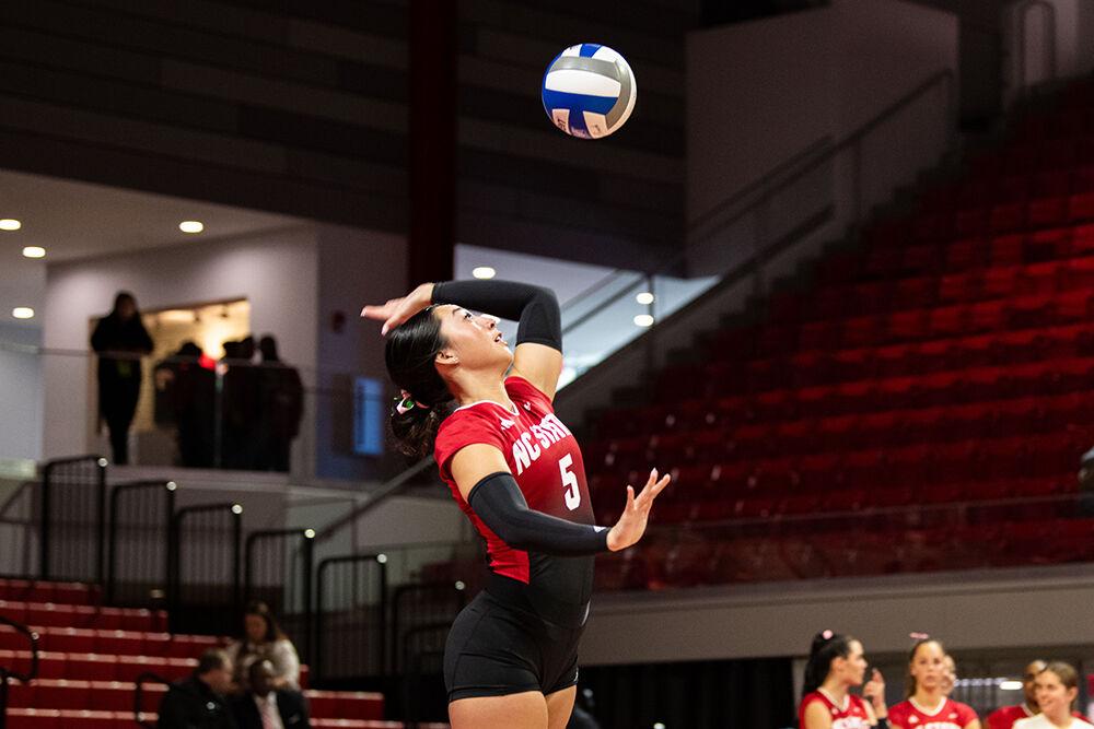 Graduate student setter Kristen McDaniel serves the ball during the match against UVA in Reynolds Colliseum on Sunday, Oct. 22, 2023. McDaniel served one ace during the match. NC State beat UVA 3-0.