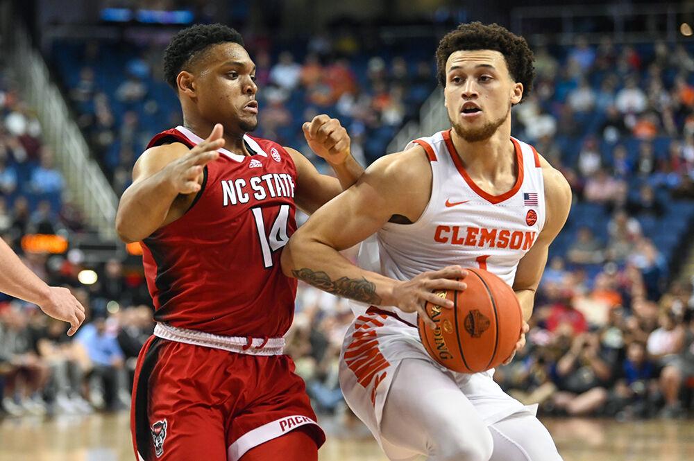 Senior guard Casey Morsell attempts to slow his opponent during the quarterfinal round of the ACC Tournament against Clemson in Greensboro Coliseum on Thursday, March 9, 2023. Morsell made three rebounds for the Pack. The Wolfpack lost the game 80-54.
