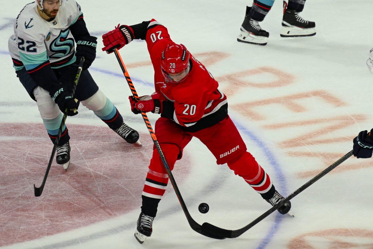 Carolina Hurricanes center Sebastian Aho slaps at the puck during the game against the Seattle Kraken in PNC Arena on Thursday, Oct. 26, 2023. Aho had one assist during the game. The Hurricanes beat the Kraken 3-2 in overtime.
