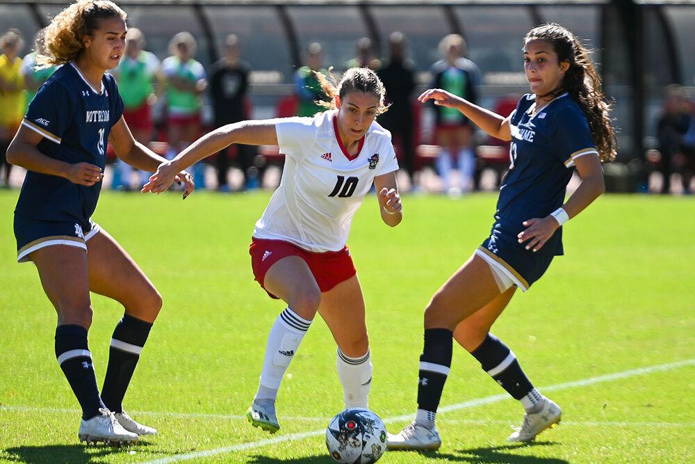 Junior midfielder Annika Wohner dribbles through defenders during the match against Notre Dame at Dail Soccer Field on Sunday, Oct. 22, 2023. NC State lost to Notre Dame 1-0.