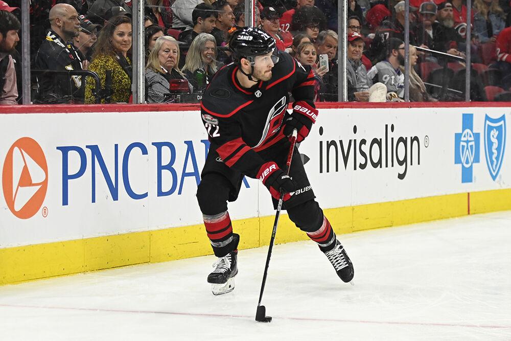 Carolina defenseman Brett Pesce holds the puck behind the net during the Hurricanes' home game against the Tampa Bay Lightning in PNC Arena on Tuesday, March 28, 2023. The Lightning beat the Canes 4-0.