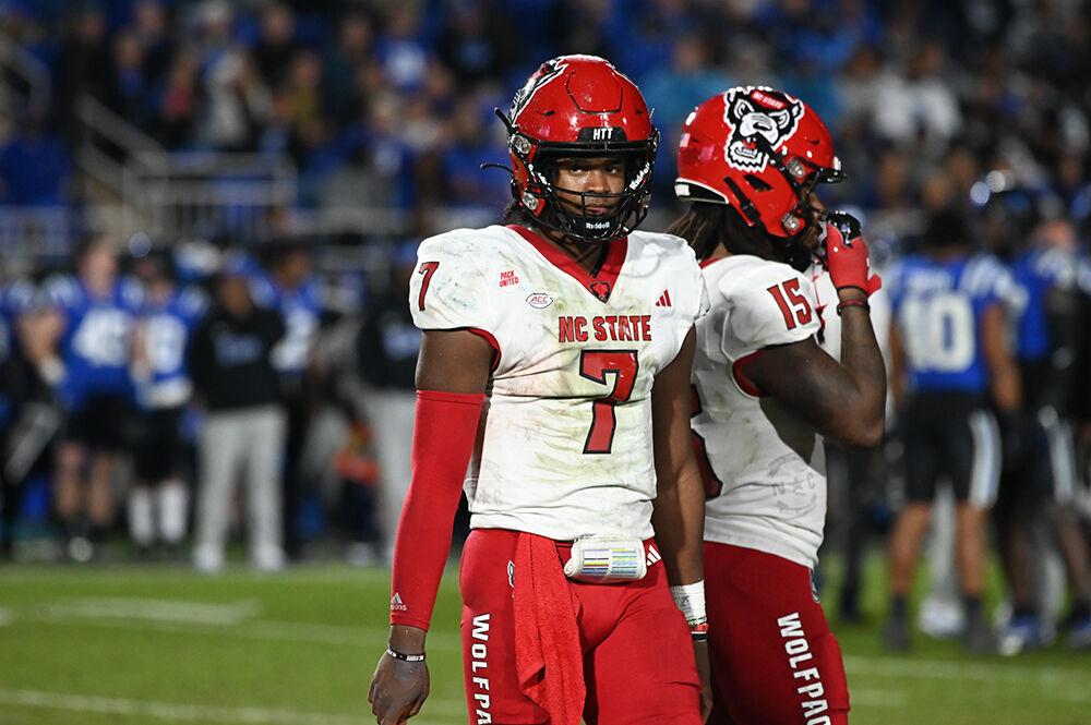 Sophomore quarterback MJ Morris looks over at the sideline during the Wolfpack's game against the Duke Blue Devils at Wallace Wade Stadium on Saturday, Oct. 14, 2023. The Blue Devils defeated the Wolfpack 24-3.