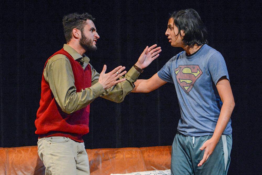 Andrew Jackson, a third-year studying political science, and Fayaz Shaikh, a fourth-year studying computer engineering, argue during the performance of "What We Grew Up With" at Kennedy-McIlwee Studio Theatre on Thursday, Nov. 2, 2023. The play was written by Kiran Soma, winner of the 2023 Creative Artist Award in Theatre.