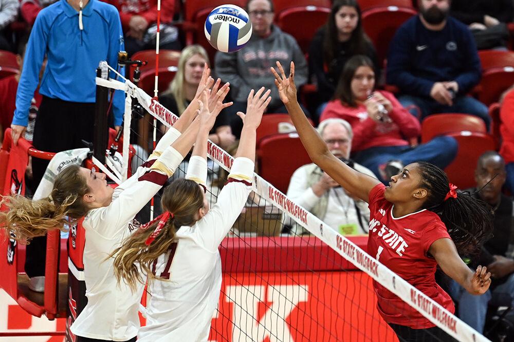 Redshirt junior outside hitter Madison Williams tips the ball over the block during the match against Boston College in Reynolds Coliseum on Friday, Nov. 3, 2023. Williams made four kills and had three digs. NC State lost to Boston College 3-2.