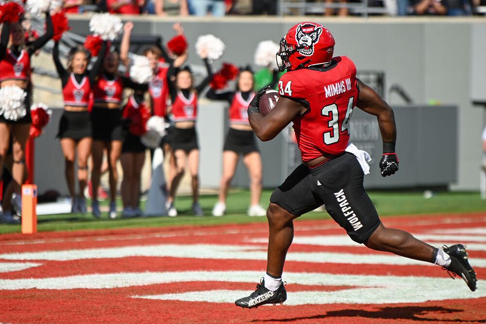 Redshirt junior running back Delbert Mimms flies into the end zone during the game against Marshall at Carter-Finley Stadium on Saturday, Oct. 7, 2023. NC State won the game 48-41.