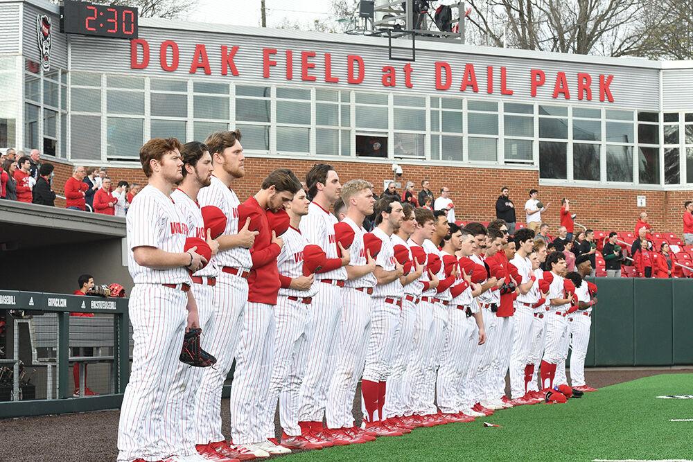 The Wolfpack baseball team lines up for the anthem before the opening day game against the Wagner Seahawks on Doak Field at Dail Park on Friday, Feb. 17, 2023. The Wolfpack beat the Seahawks 14-1.