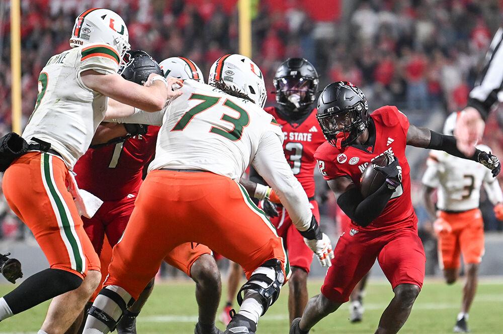 Junior nickel corner back Devan Boykin runs the ball down the field after catching an interception during the game against Miami at Carter-Finley Stadium on Saturday, Nov. 4, 2023. Boykin completed six total tackles. NC State beat Miami 20-6.
