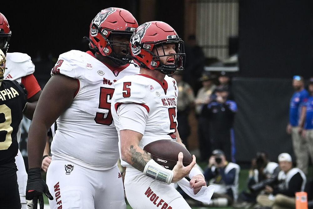 Graduate quarterback Brennan Armstrong celebrates a rushing touchdown during the game against the Wake Forest Demon Deacons in Allegacy Federal Credit Union Stadium on Saturday, Nov. 11, 2023. The Wolfpack beat the Demon Deacons 26-6.