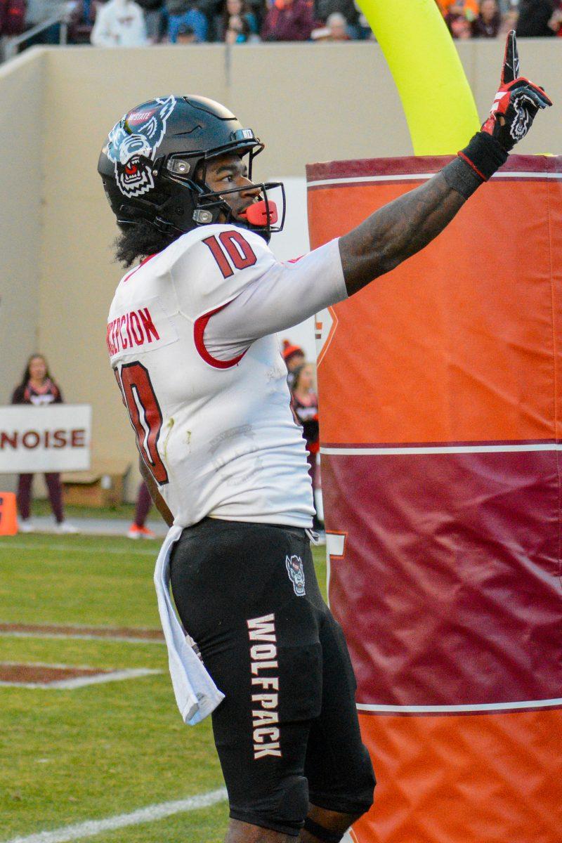 Freshman wide receiver Kevin "KC" Concepcion strikes a pose after scoring a touchdown during the game against Virginia Tech at Lane Stadium on Saturday, Nov. 18, 2023. Wolfpack beat the Hokies 35-28.