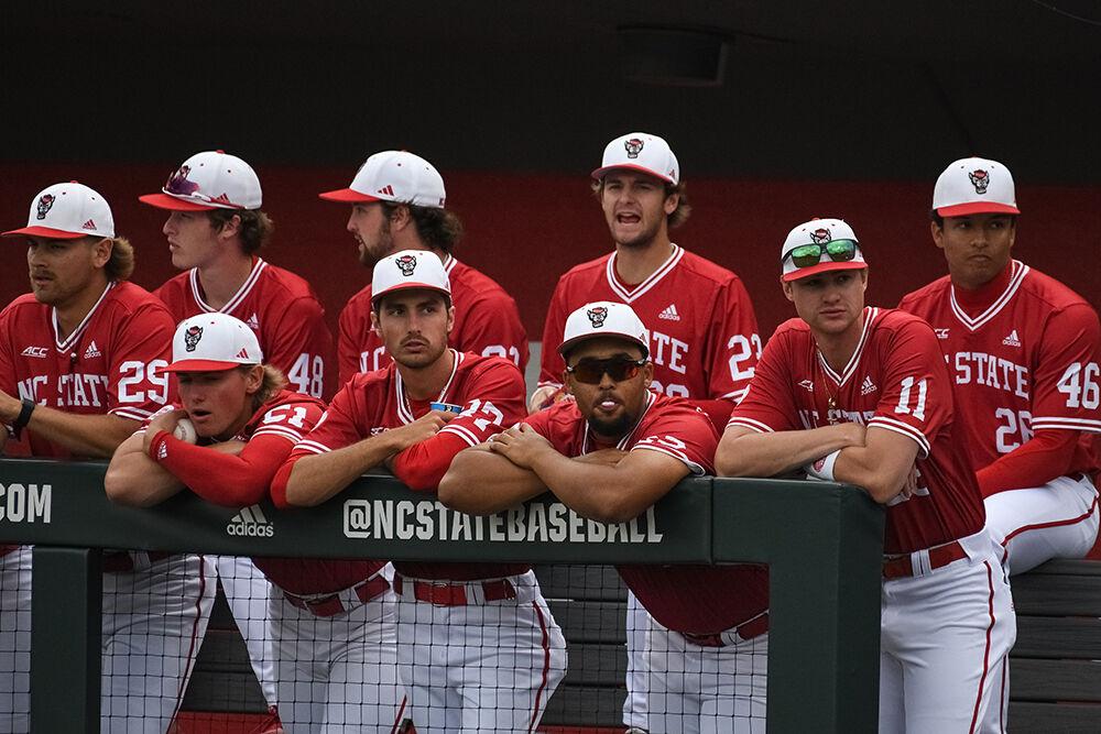 NC State baseball players watch from the dugout during the Wolfpack's home game against East Carolina University on Doak Field at Dail Park on Tuesday, April 25, 2023. The Wolfpack beat the Pirates 5-4.