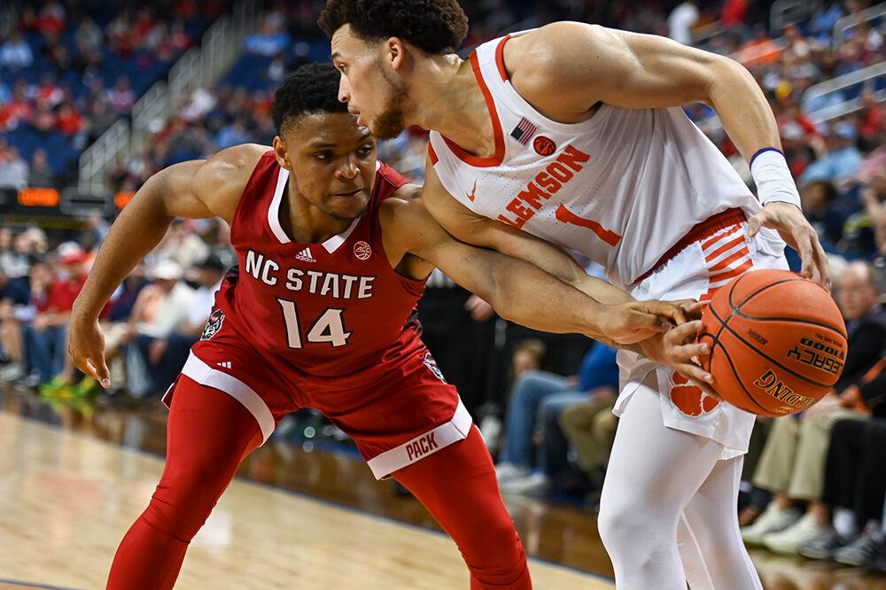 Senior guard Casey Morsell tries to strip the inbounded ball during the quarterfinal game of the Men's ACC Tournament versus the Clemson Tigers in Greensboro Coliseum on Thursday, March 9, 2023. Clemson beat NC State 80-54.