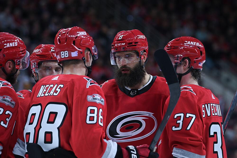 Defenseman Brent Burns (center) huddles up with the team during the Hurricanes' home game against the Edmonton Oilers on Thursday, Nov. 10, 2022 in PNC Arena. Burns had one goal for one point as the Canes beat the Oilers 7-2.
